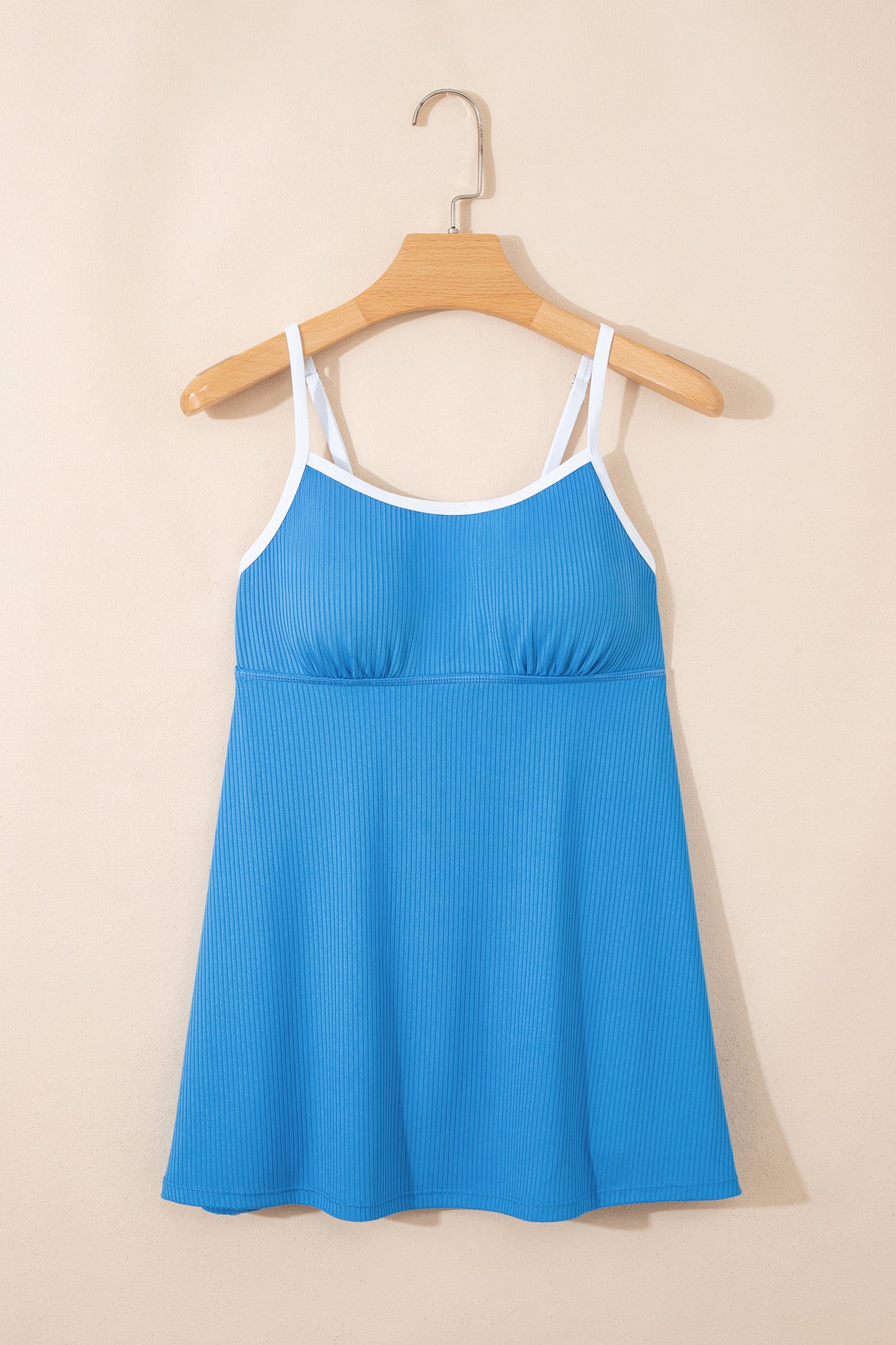 Dusk blue Cali Chic women's swimsuit swim dress with color block design, ribbed texture, pocket details, and lined fabric.