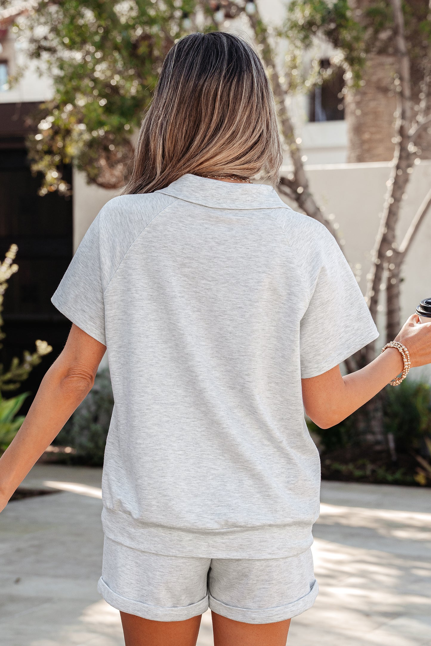 Light grey women's short set with collared V-neck tee and drawstring elastic waist shorts from Dear-Lover, casual two-piece outfit.