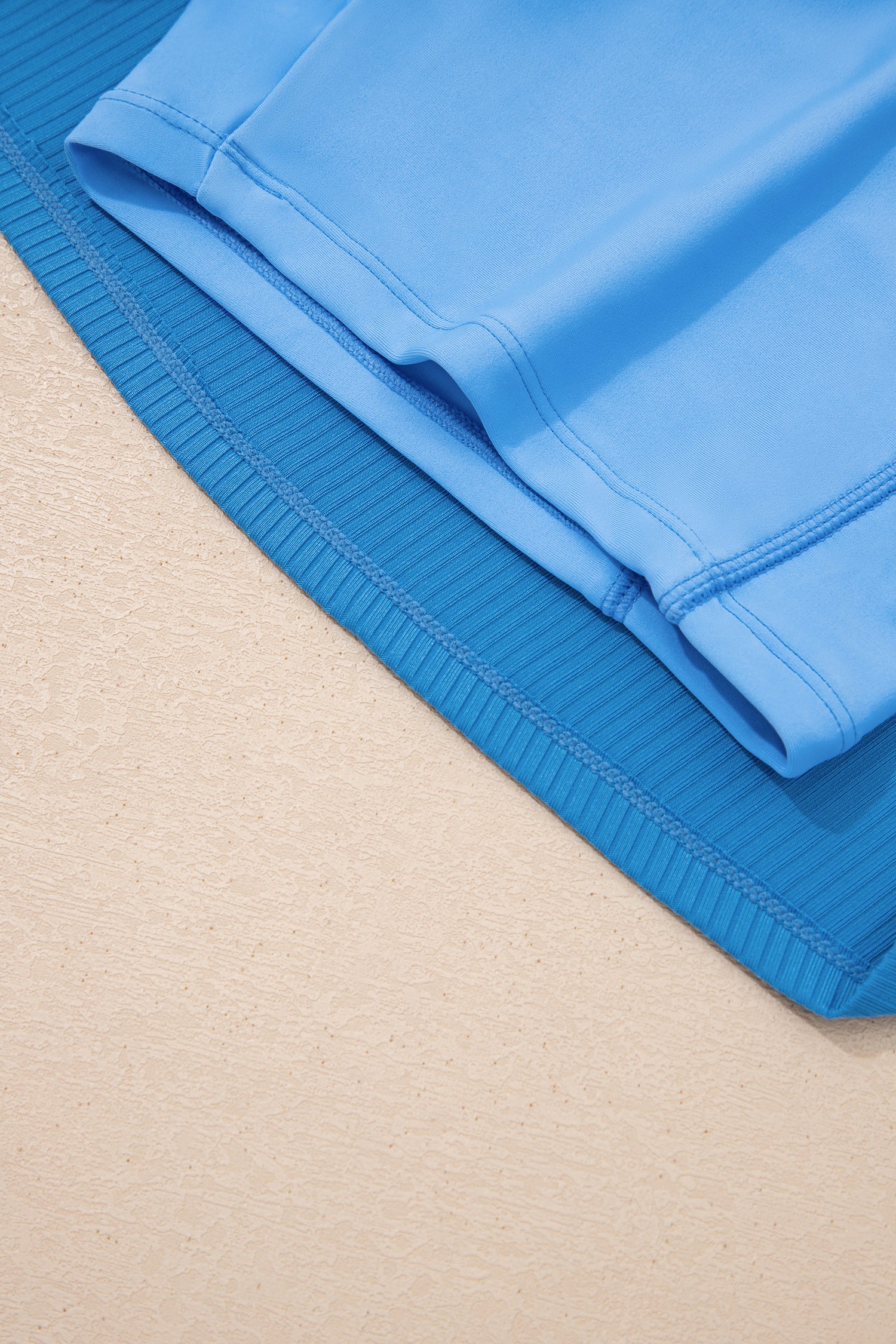 Dusk blue Cali Chic women’s ribbed swim dress with color block edges, pockets, and lining, perfect for beach and pool outings.