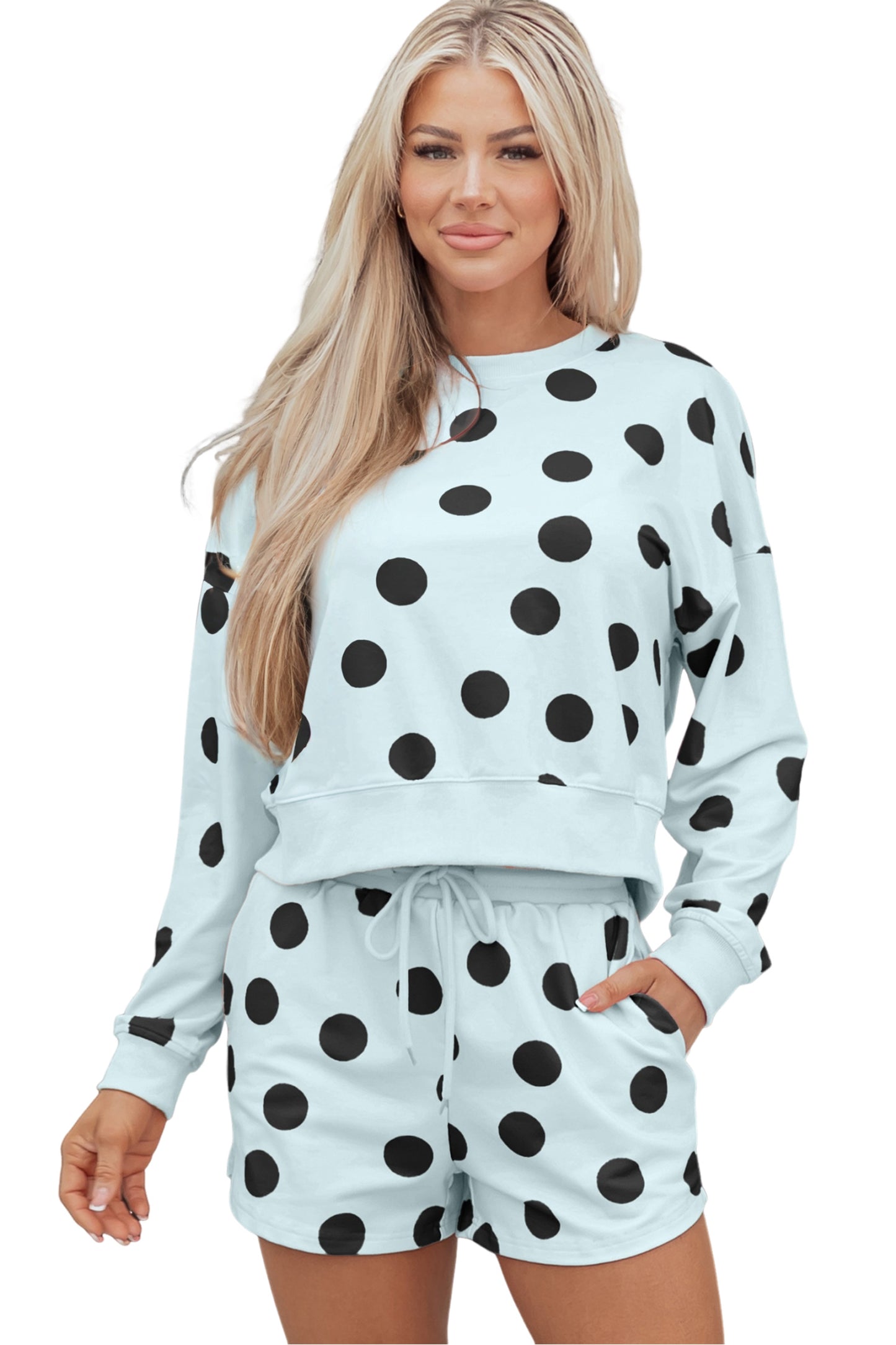 Sky blue polka dot print women’s two-piece pullover and drawstring shorts set by Dear-Lover with drop shoulder design.